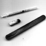 Needles, glue, and file used in cock fighting