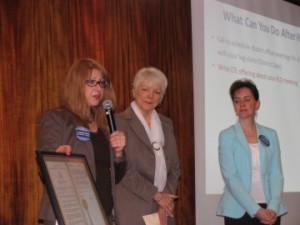 Board members, Pat Valusek and Tracey Collins, accept Resolution from Assemblywoman Linda Rosenthal. 