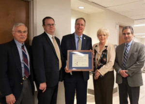 Orange Co. DA Dave Hoovler accepting award for DA's office from NYSHA Board Members