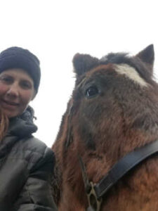 Mia Genovesi with Duke, retired police horse